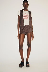 GILET EFFET DAIM À CLOUS