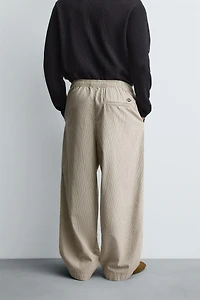 BALLOON FIT PLEATED PANTS