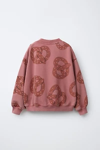 PRINTED PRETZEL SWEATSHIRT