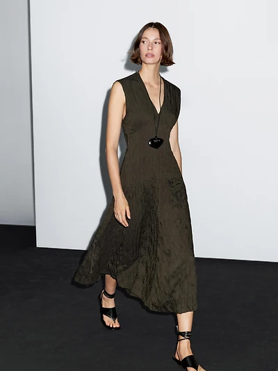 Creased-effect long pleated dress