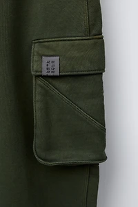 PANTALON EN MOLLETON LARGE CARGO TEINT PIÈCE