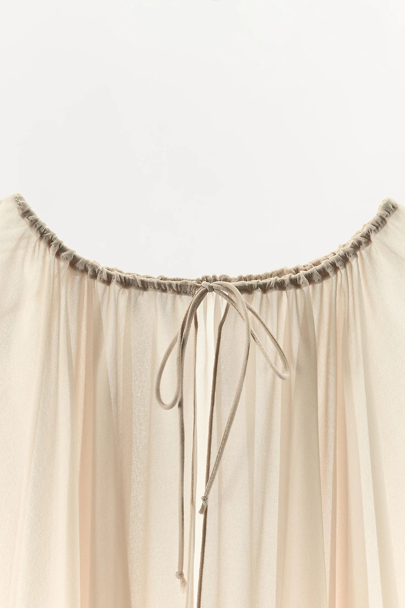 RUFFLED CAPE