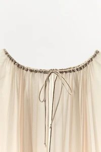 RUFFLED CAPE