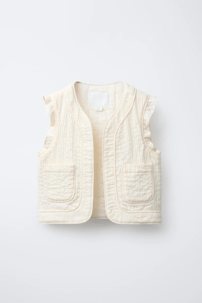 TEXTURED RUFFLE VEST