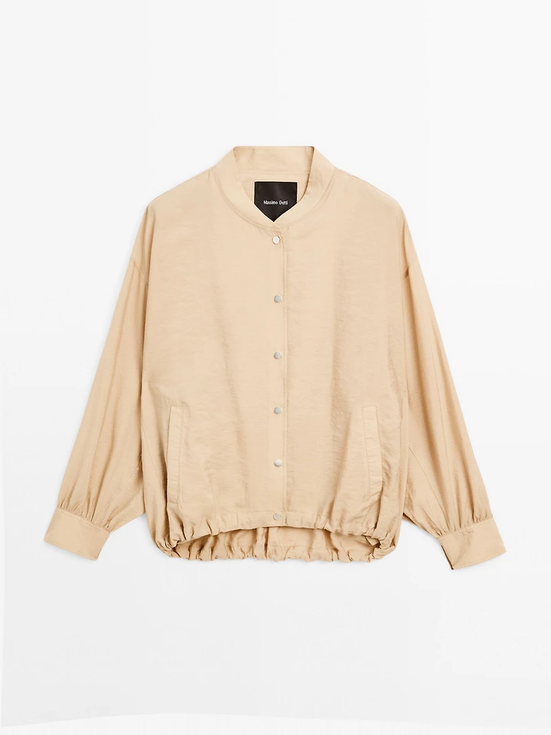 Loose-fitting bomber jacket with drawstring detail