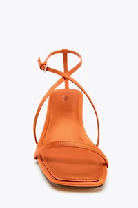 SATIN-EFFECT CROSSED STRAP SANDALS