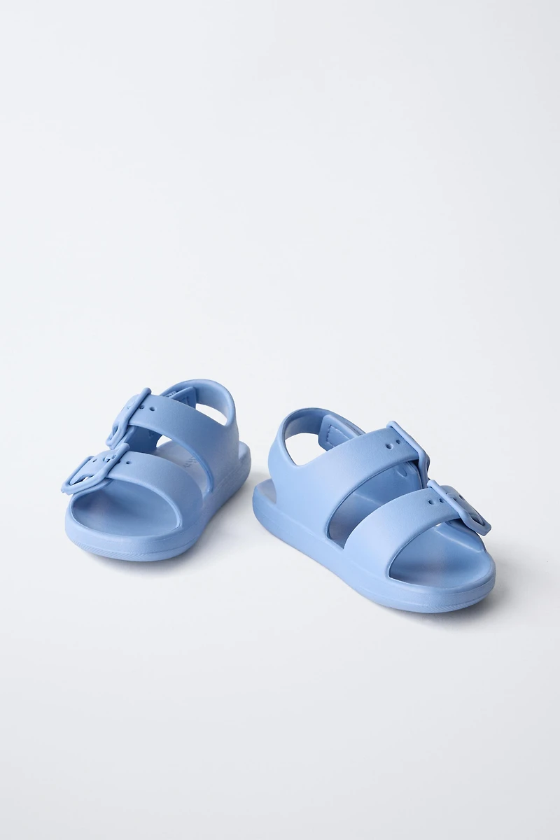 RUBBERIZED BUCKLED SANDALS