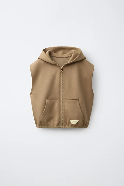 GILET À CAPUCHE EN INTERLOCK