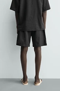 RELAXED FIT PLEATED SHORTS