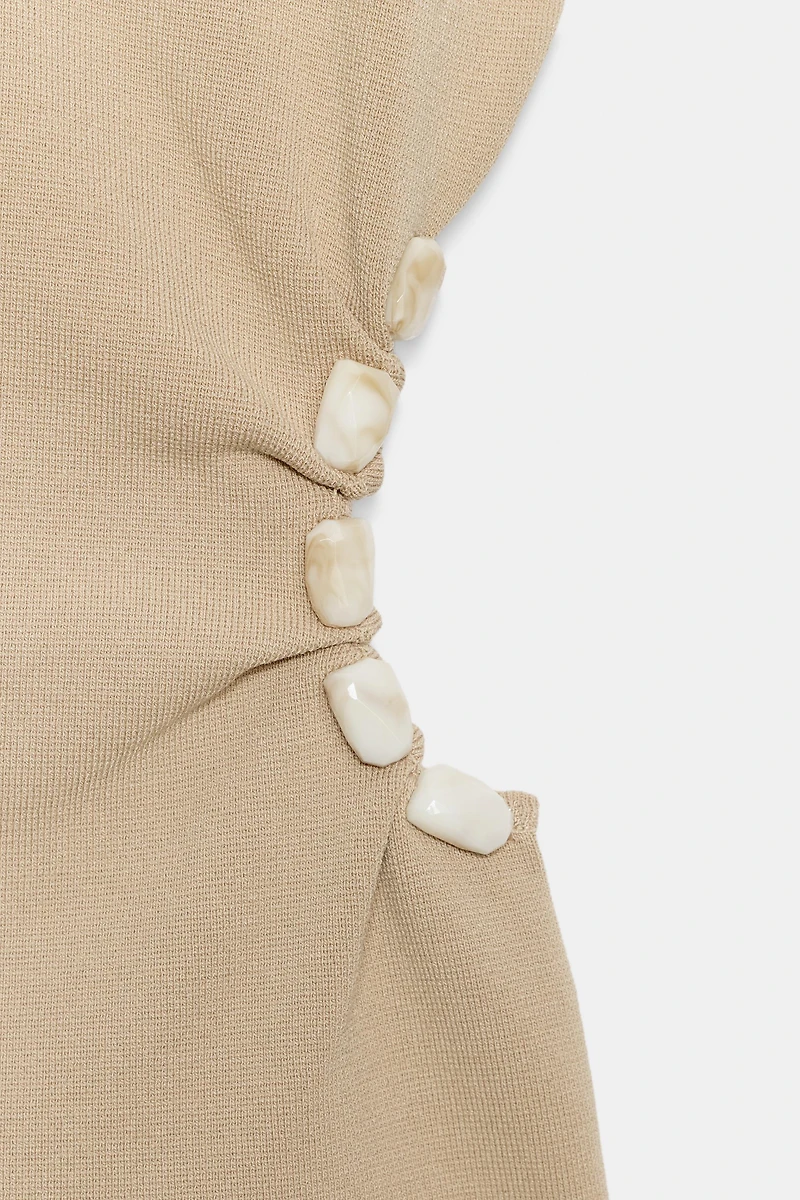 TOP EN MAILLE AJOURÉ AVEC PERLES