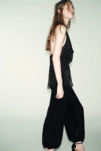 TOP HALTER À FRANGES ET PAILLETTES