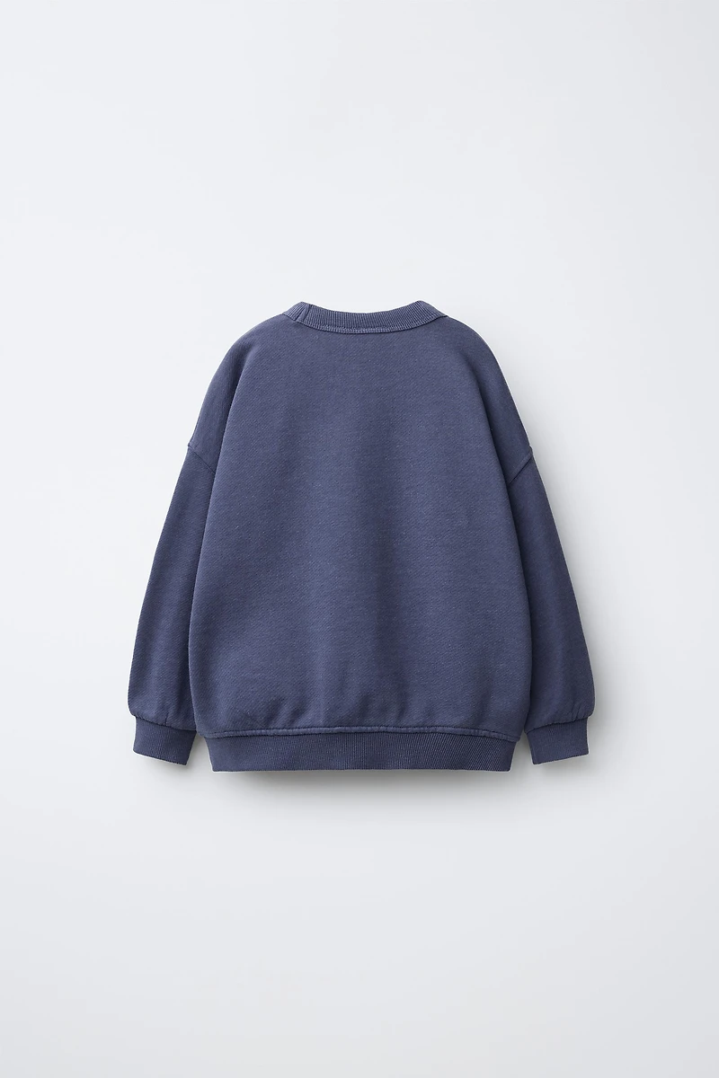 SWEAT AVEC INSCRIPTION IMPRIMÉE