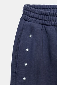 PANTALON DE JOGGING DÉLAVÉ AVEC CLOUS