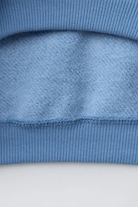 SWEAT BASIQUE À INSCRIPTION
