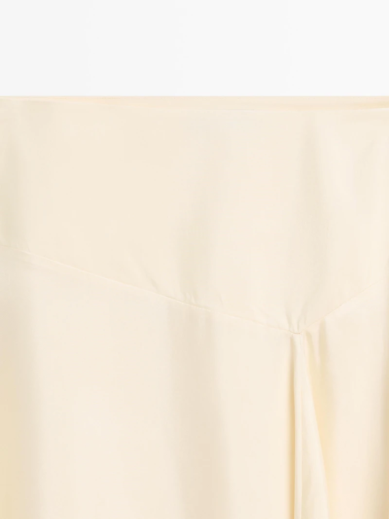 Asymmetric skirt with lace-trimmed detail