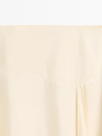 Asymmetric skirt with lace-trimmed detail