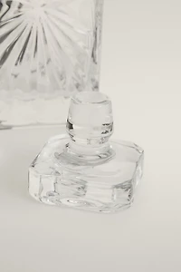 CRYSTALLINE BOTTLE WITH RAISED DESIGN