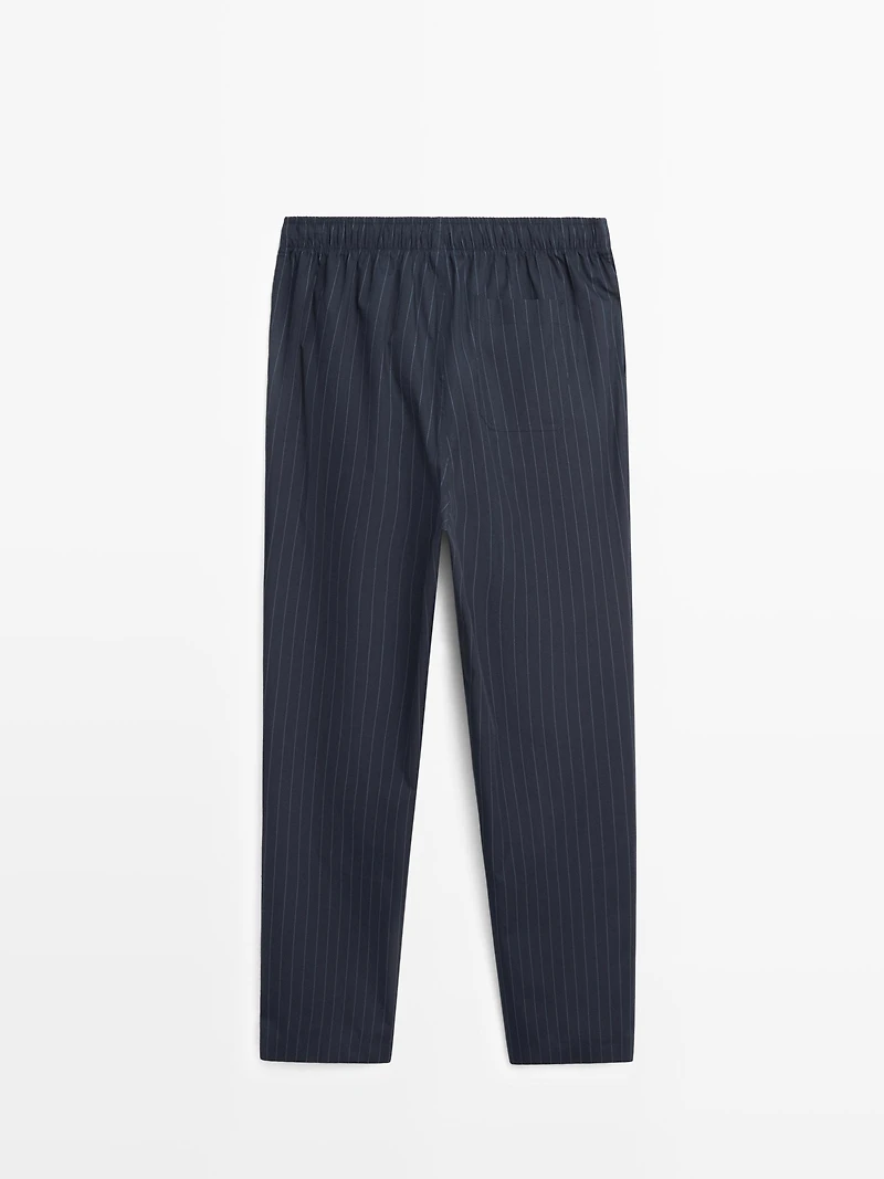 Short sleeve pyjama top and striped trousers