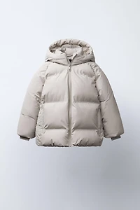 MANTEAU AVEC ÉTIQUETTE AUTOCOLLANTE DÉPERLANT