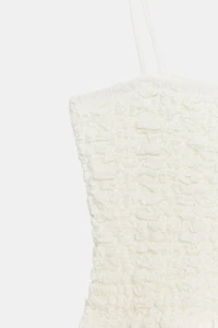 SMOCKED PEPLUM TOP