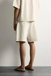 WIDE FIT STRIPED PLEATED SHORTS