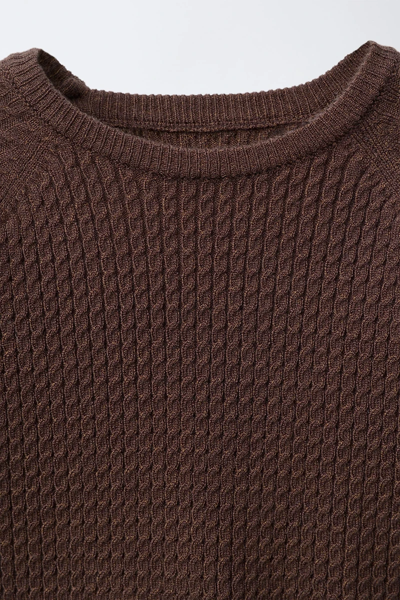 PULL EN MAILLE À TORSADES