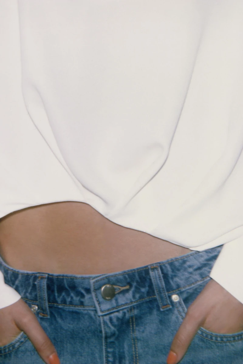 ASYMMETRIC PLEATED HEM SHIRT