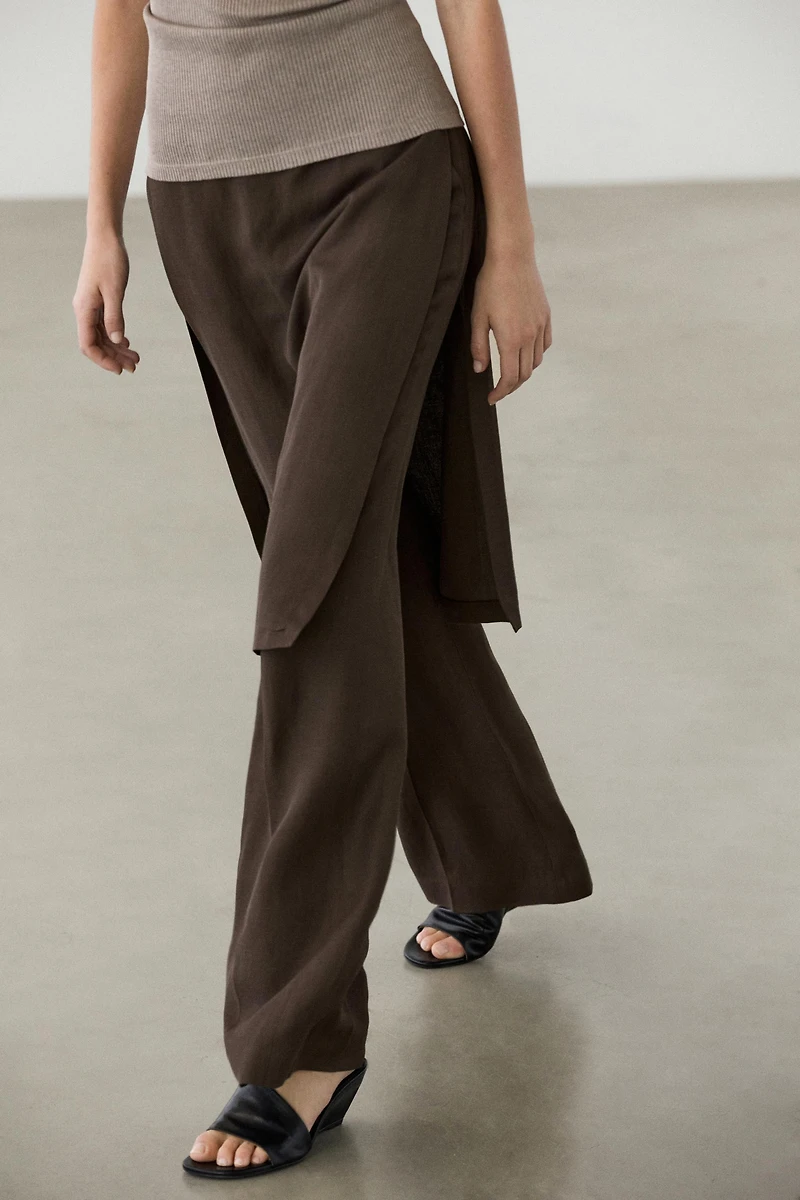 Flowing trousers with skirt detail