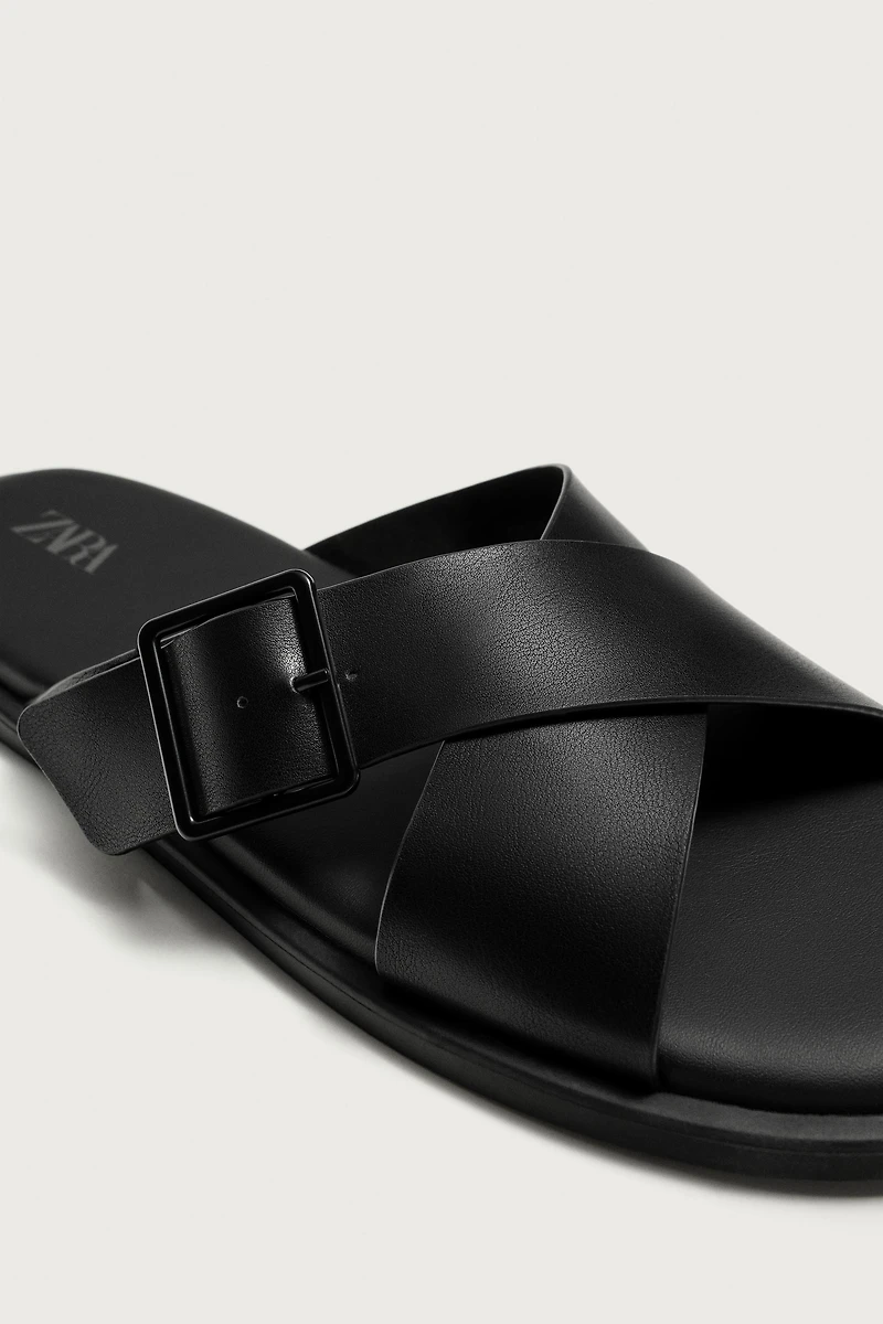 BUCKLED CRISSCROSS SANDALS