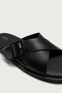 BUCKLED CRISSCROSS SANDALS