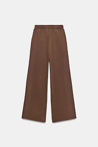 PANTALON EN MOLLETON EFFET DÉLAVÉ CLOUS