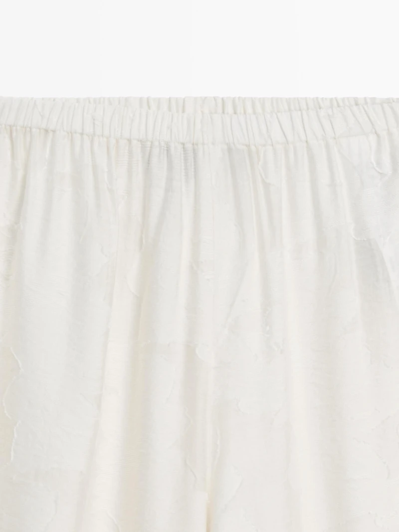 Pantalon élastique fluide détail tissu