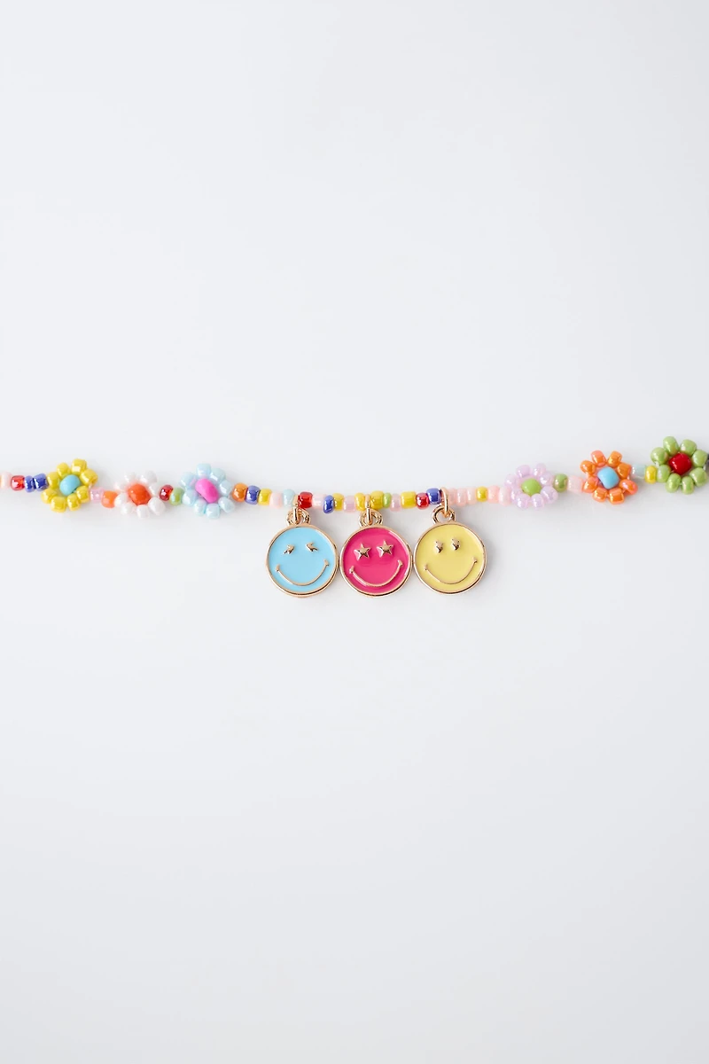 PACK OF RINGS AND BEADED BRACELET SMILEYWORLD ®