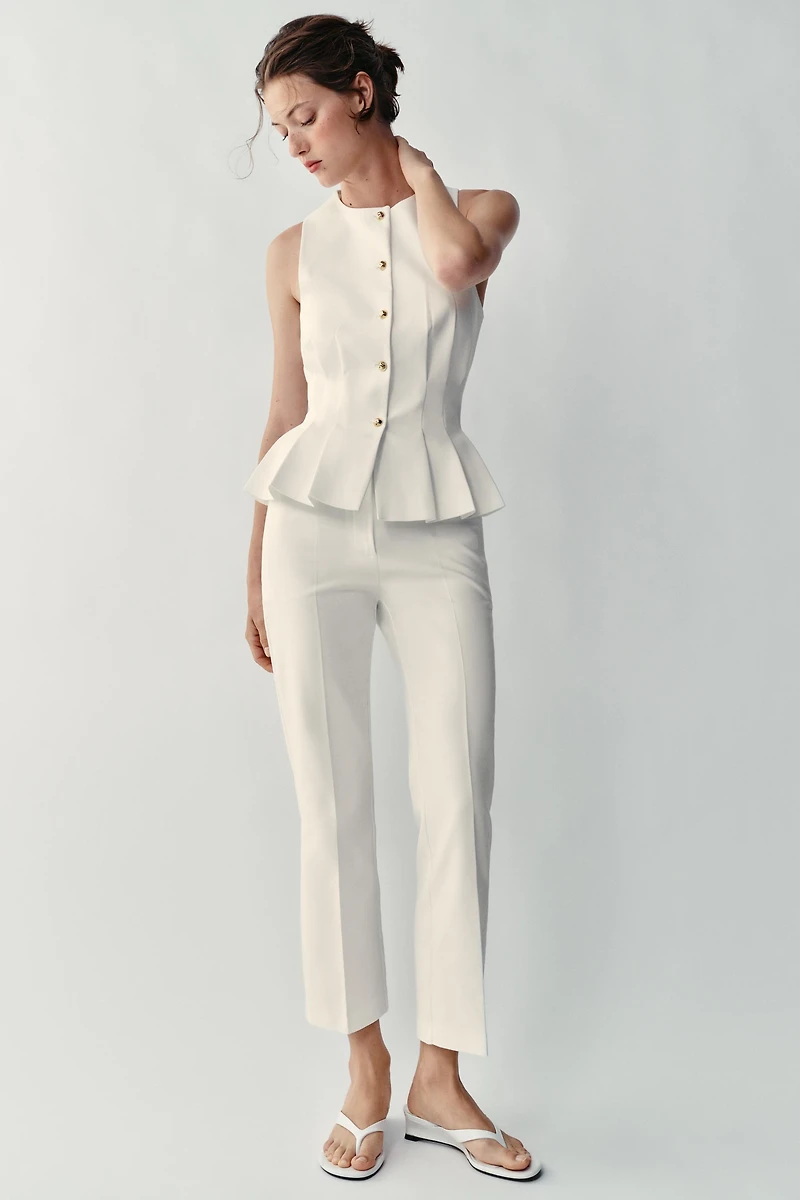GILET À PINCES