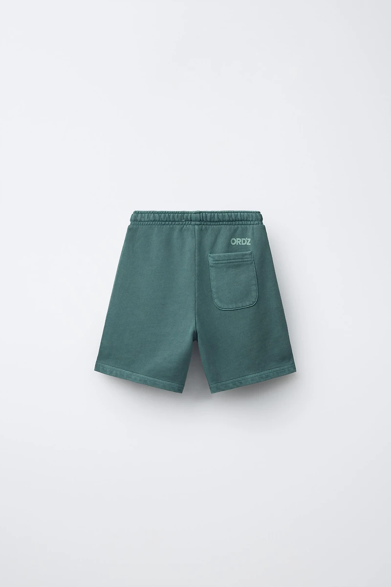 GARMENT DYED LOGO PLUSH SHORTS