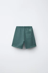 GARMENT DYED LOGO PLUSH SHORTS