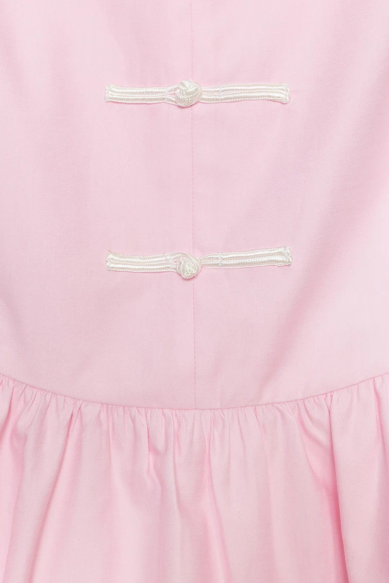 PEPLUM TOP WITH FROG CLASPS