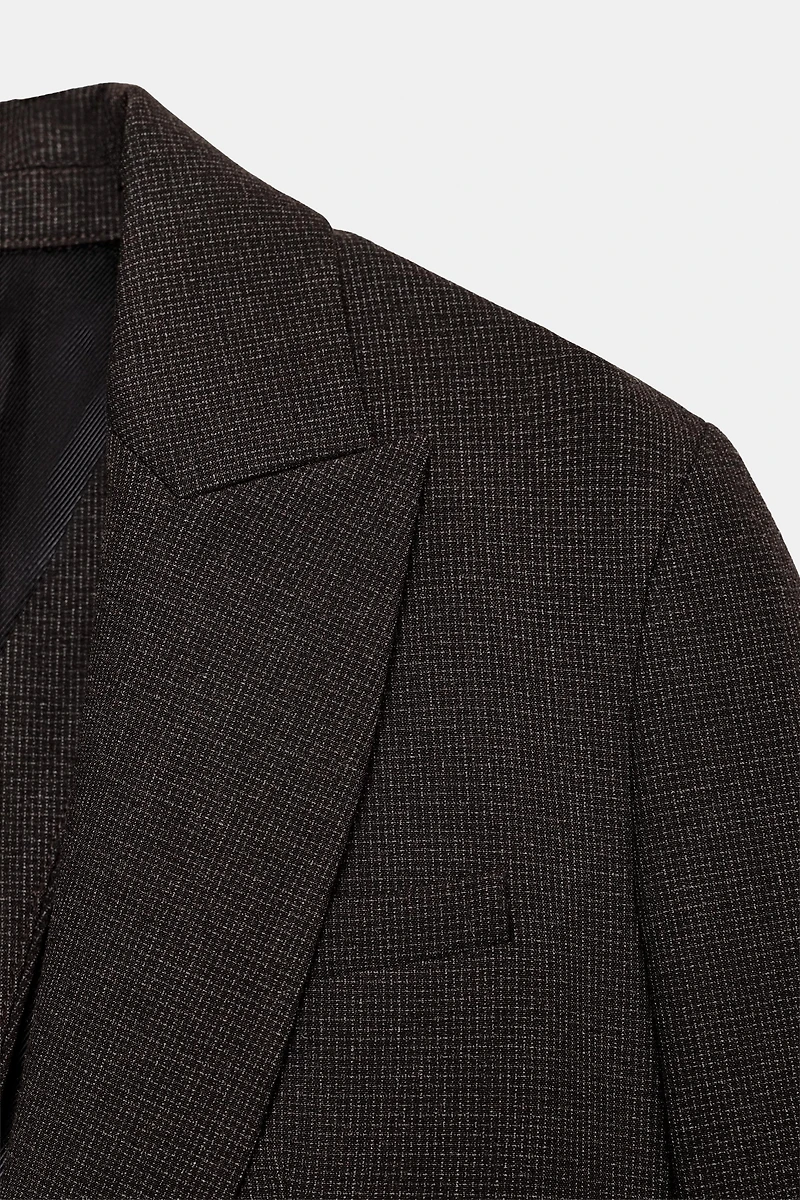 BLAZER WITH SHOULDER PADS AND BUTTONED BACK