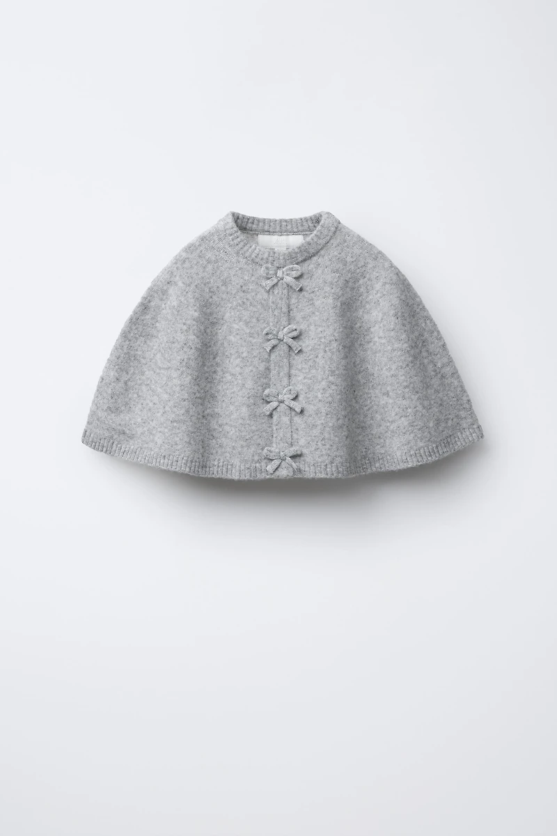 CAPE PONCHO WITH BOWS