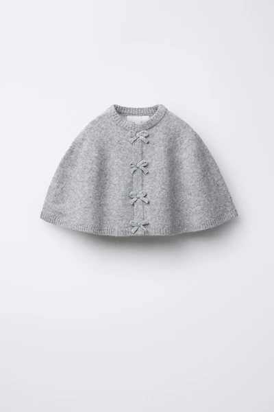 CAPE PONCHO WITH BOWS