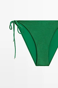 Bas de bikini à nœud brillant