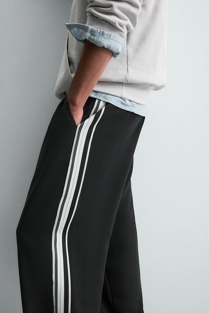 WIDE FIT JOGGER PANTS WITH SIDE STRIPES
