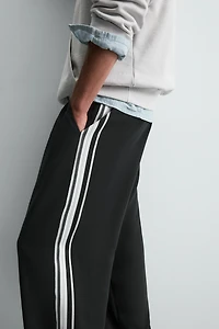 WIDE FIT JOGGER PANTS WITH SIDE STRIPES