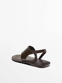 Embossed animal print sandals