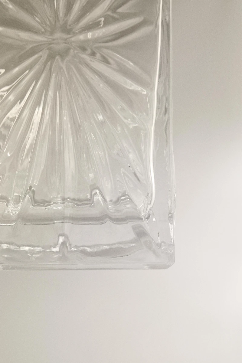 CRYSTALLINE BOTTLE WITH RAISED DESIGN
