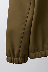 HOODED TECHNICAL JACKET