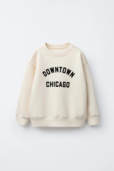 SWEAT À INSCRIPTION FLOQUÉE