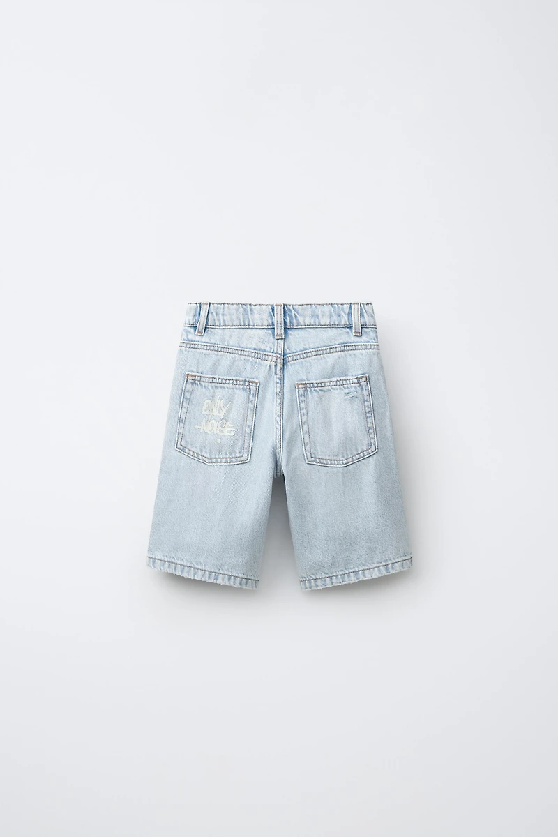 RIPPED AND GRAFFITI DENIM SHORTS
