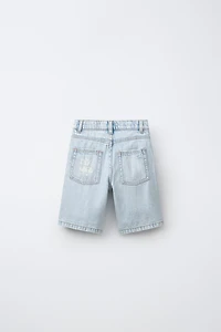 RIPPED AND GRAFFITI DENIM SHORTS