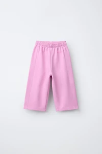 WIDE LEG INTERLOCK RAISED TEXT PANTS